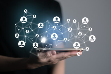 . Virtual visualization of network chain with person icons, female unrecognised manager on background. Human capital and teambuilding concept.