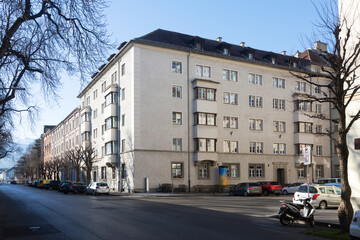 Naklejka premium Large residential building and street with cars in Innsbruck, Tyrol