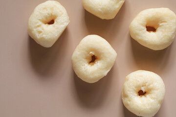 Sweet donuts on brown background. Morning breakfast food concept. Copy space. Coffee break time.
