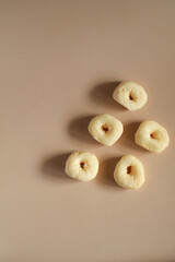 Sweet donuts on brown background. Morning breakfast food concept. Copy space. Coffee break time.