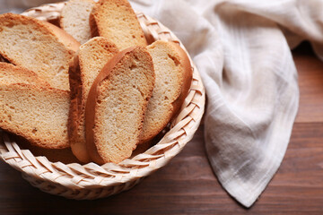 Hard chuck crackers in wicker basket on wooden table