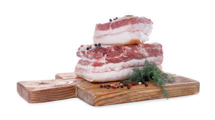 Pieces of pork fatback served with dill and spices isolated on white