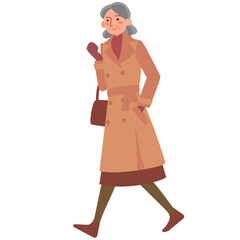 トレンチコートを着て歩くシニア女性