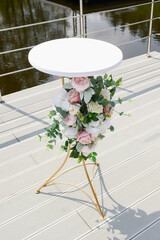 White color wedding table for wedding ceremony decorated with flowers