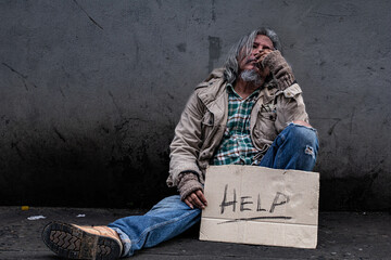 Homeless poverty man feeling despond hold signs for help. old pity man with beard begging for money. society's economic problem abandoned hopeless elderly. pauper people on home sleep on footpath.