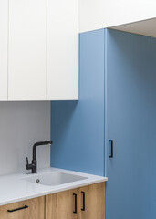 water mixer and sink at modern kitchen