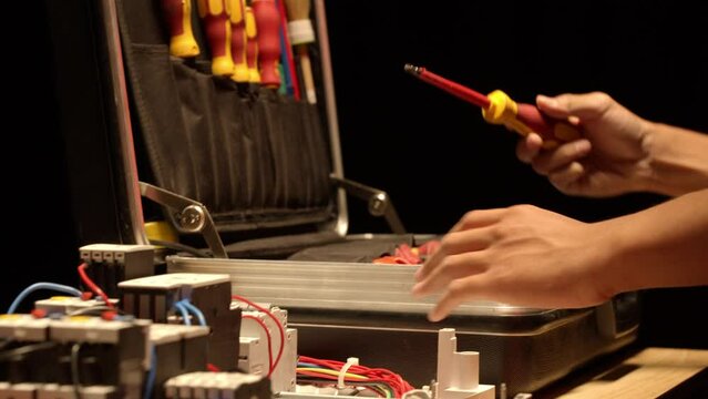 Electrician opening his tool box. 