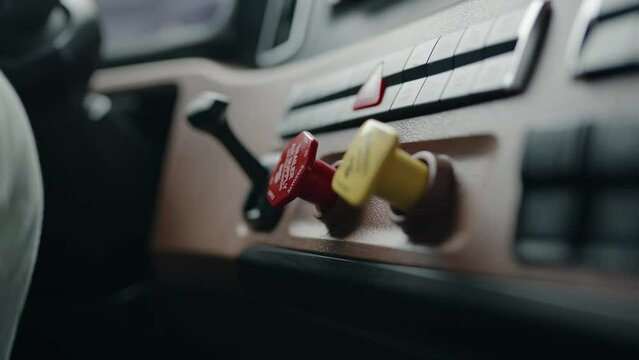 close up of tractor trailer parking knob. Changing focus from yllow to red. Inside of the cabin USA Semi Truck freightliner cascadia Volvo new 2023 model. Cinematic Shot