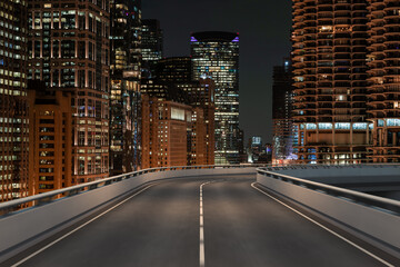 Empty urban asphalt road exterior with city buildings background. New modern highway concrete construction. Concept of way to success. Transportation logistic industry fast delivery. Chicago. USA.