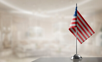 A small Liberia flag on an abstract blurry background