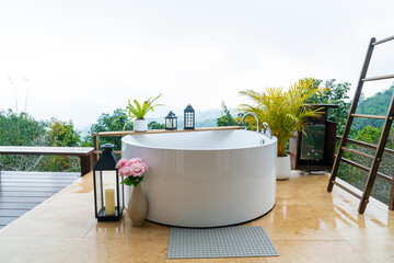 outdoor bath tub with beautiful mountain view background