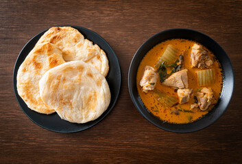 Chicken curry soup with roti