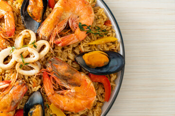 Seafood Paella with prawns, clams, mussels on saffron rice