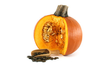 Pumpkin seeds and fresh pumpkin isolated on white