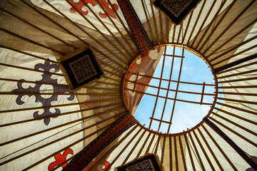 Shanyrak with Kazakh national ornament, bottom view from Kazakh national dwelling Yurt.