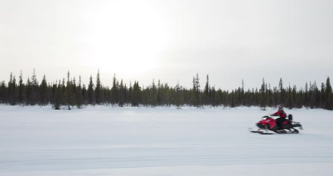Snowmobile expedition on a winter day in Lapland, Sweden