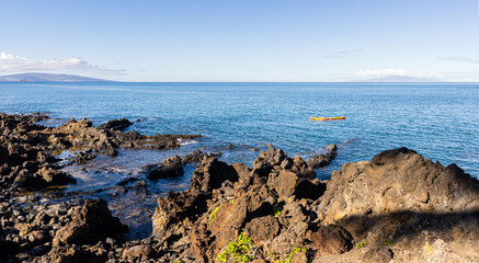 Fototapeta na wymiar The Rocky Shoreline of Wailea Beach Along The Wailea Oceanfront Boardwalk Trail, Wailea, Maui, Hawaii, USA
