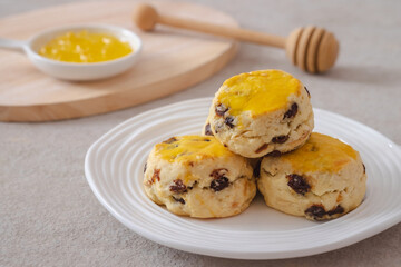 Raisin scones on white plate