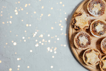 Christmas mince pies with fruit filling on a gray background.