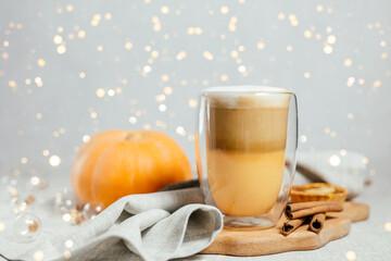 Pumpkin spicy latte on a gray background.