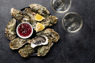 Fresh oysters with glasses of sparkling wine