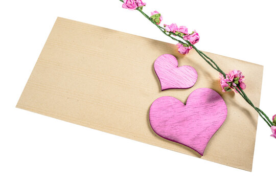 Red heart and flower stem with empty brown paper for copy space