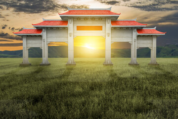 Chinese pavilion gate with red roof on the meadow