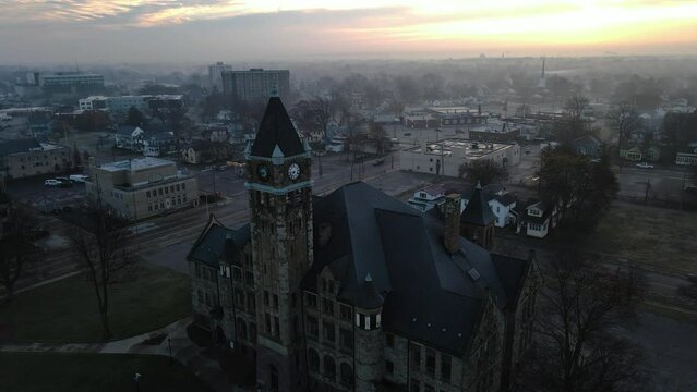 Gloomy and foggy day with the sun peaking out from the clouds.