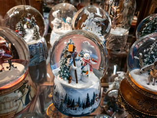 Decorative glass balls with Christmas motifs and snow figures