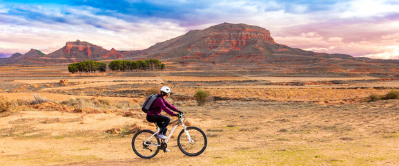 Woman riding by mountain bike