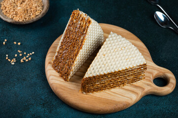 Waffle cake made of crispy waffle cakes with boiled condensed milk. Ukrainian dessert. Quick sweet dessert.