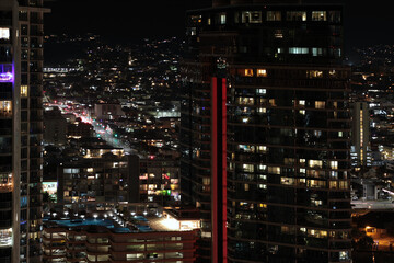 Fototapeta na wymiar Aerial night view of streets and apartments in Honolulu, HI