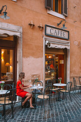 Woman Drinking Coffee in Rome Italy