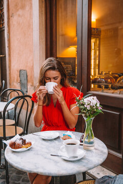 Woman Drinking Coffee in Rome Italy