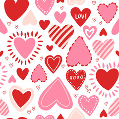 Vector seamless pattern with red and pink hearts. Freehand doodle drawing for valentines day. Can be used on packaging paper, fabric, background for different images, etc.