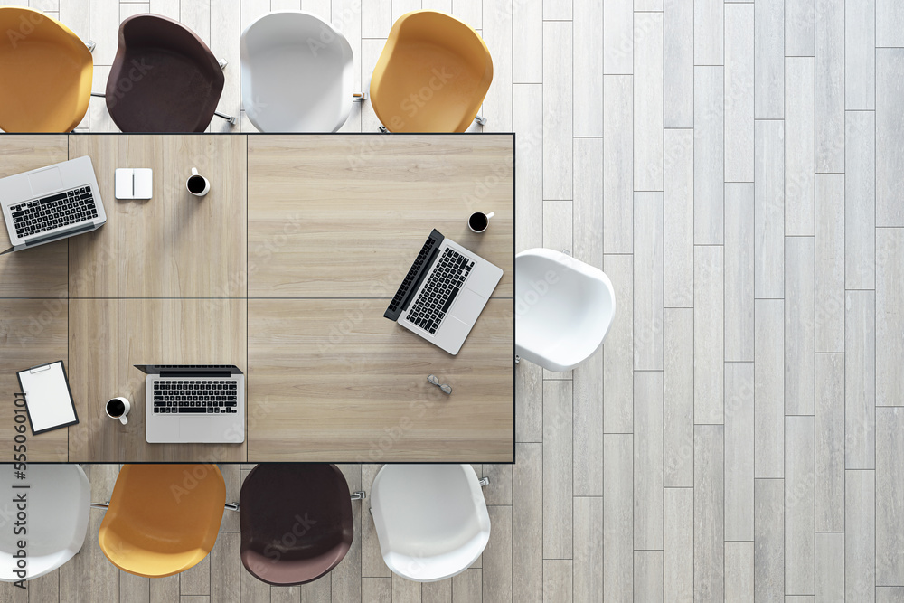 Poster work in progress concept with top view on wooden meeting table with laptops and coffee mugs surround