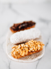 Healthy eclairs or profitroles on marble background