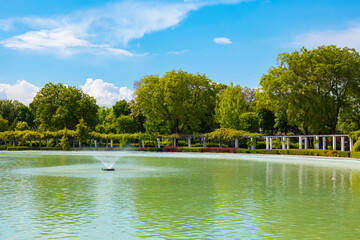 Pond in a park view. A fountain of a pond in a park.