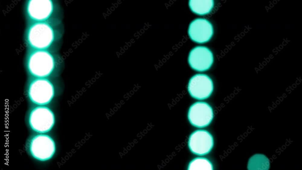 Wall mural round turquoise bokeh lines move vertically. abstract moving background with natural lens flare effe