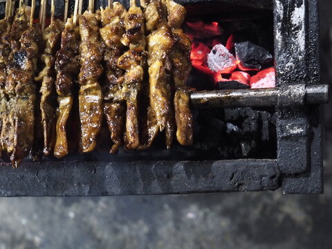 Sate Ayam, Traditional food from Indonesia. It was grilled with charcoal. Eat with peanut sauce.