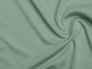 Olive green color velvet fabric texture used as background. light.Olive green fabric background of soft and smooth textile material. There is space for text.