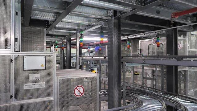 Blinking lights on empty conveyor belts on production line in automated factory before work starts