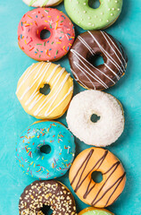 donuts on blue background, top view