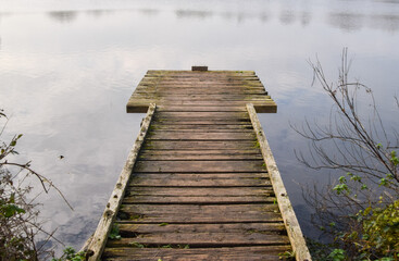 An old wooden jetty at a lake