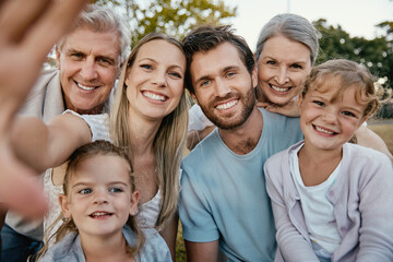 Big family, portrait smile and selfie for happy quality bonding together for fun day in the nature park. Parents, grandparents and kids faces smiling for family time, photo or holiday in the outdoors