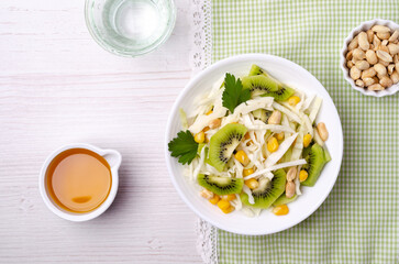 Fresh vegetables salad with kiwi