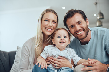 Fototapeta premium Family, happy portrait and relax with baby on sofa in living room for love, support and quality time bonding. Parents smile, holding kid and happiness together for trust on couch in family home