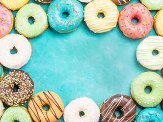 donuts on blue background , copy space, top view
