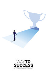 Obraz premium Silhouette businessman walking to light from exit door shape trophy. Business Concept of route to winner and champion