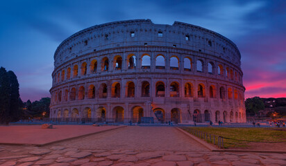 Fototapeta premium Sunrise at Rome Colosseum (Roma Coliseum), Rome, Italy - Colosseum amphitheater in Rome